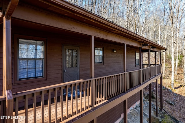 view of home's exterior with a wooden deck