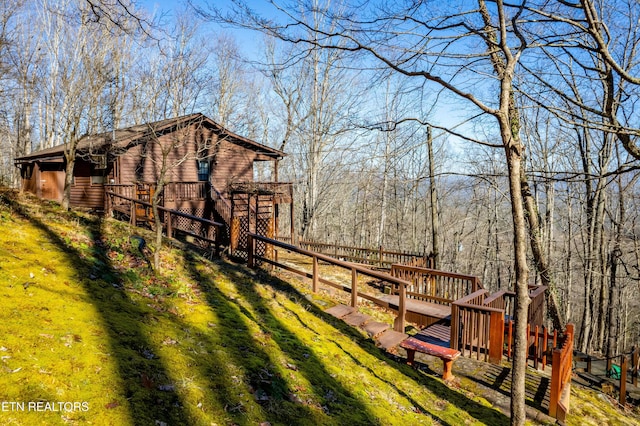 exterior space featuring a wooden deck