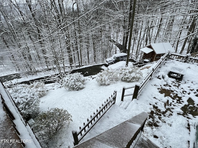 view of yard layered in snow