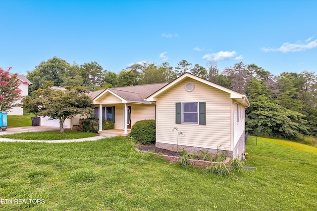 view of front of home featuring a garage and a front lawn