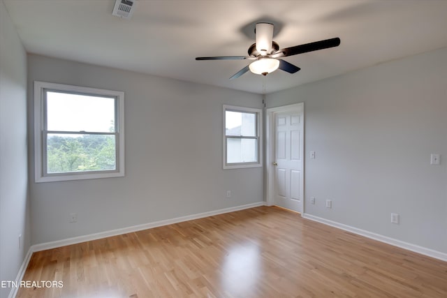 empty room featuring ceiling fan and light wood-type flooring