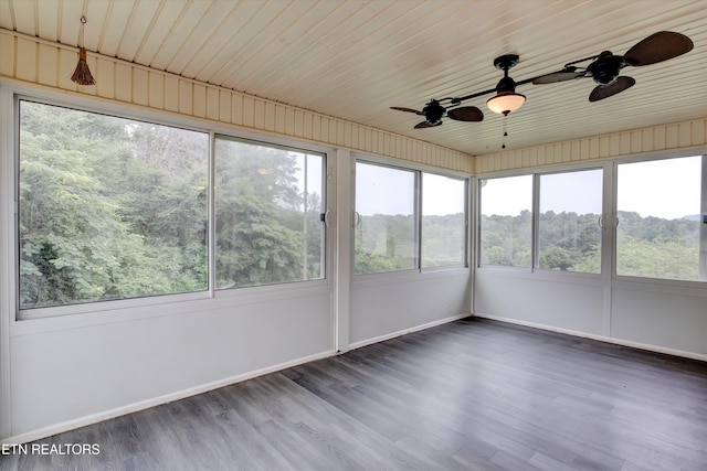 unfurnished sunroom featuring ceiling fan