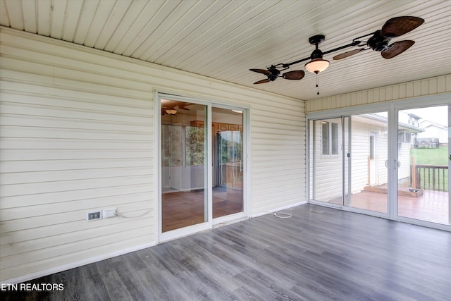 unfurnished sunroom with wooden ceiling and ceiling fan