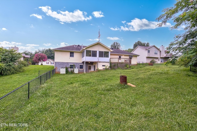 back of house featuring a yard