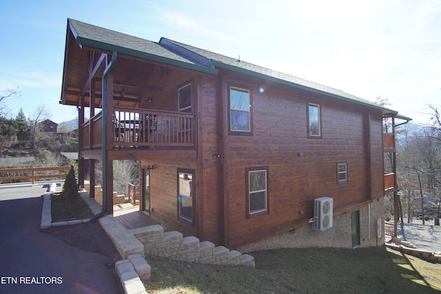 view of side of property featuring ac unit