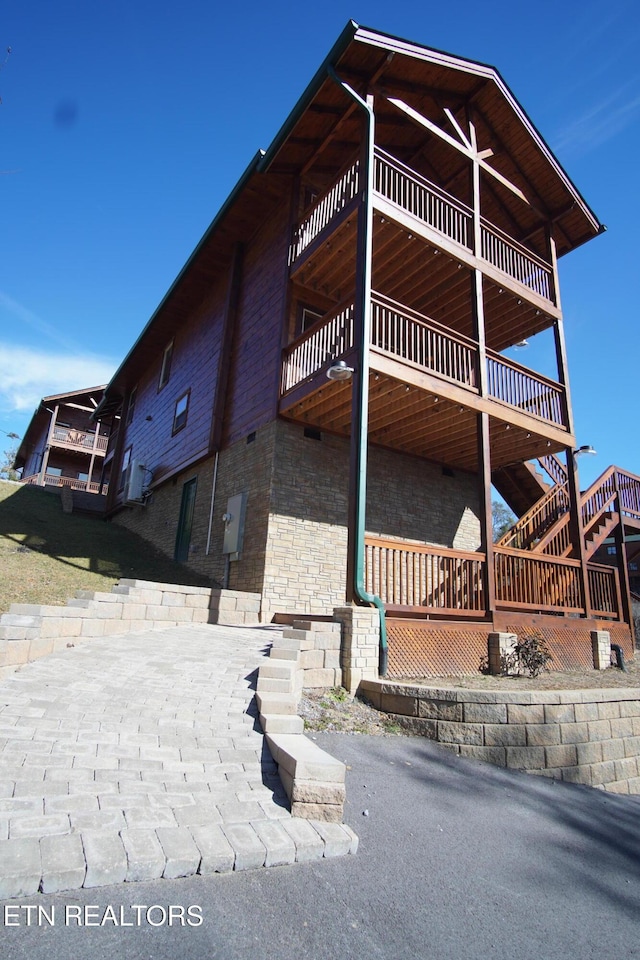 view of home's exterior with a balcony