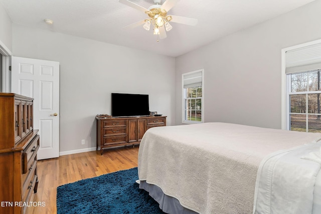 bedroom featuring ceiling fan and light hardwood / wood-style flooring