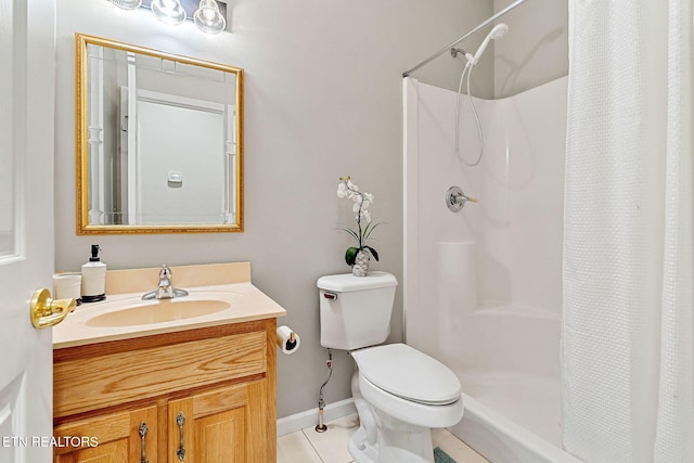 bathroom with vanity, curtained shower, tile patterned floors, and toilet