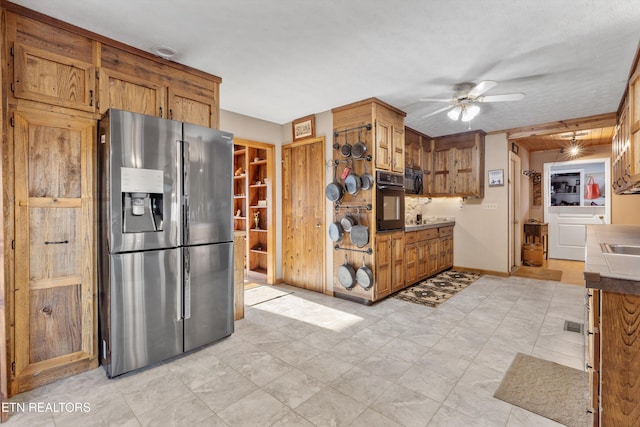 kitchen with stainless steel fridge, oven, and ceiling fan