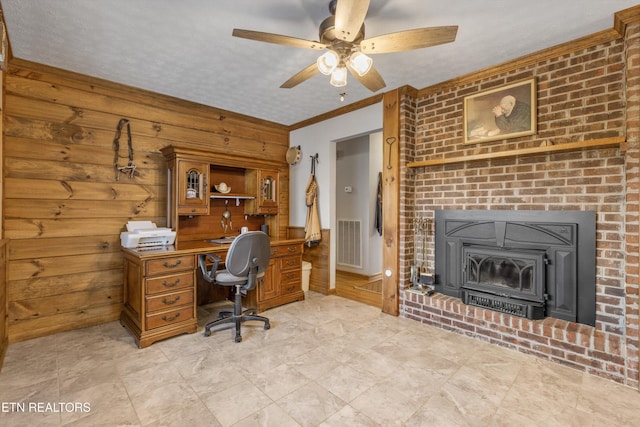 home office featuring crown molding, ceiling fan, and a textured ceiling