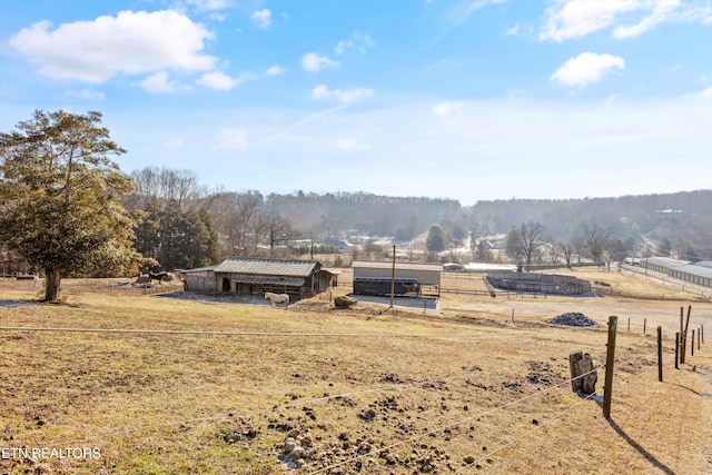 view of yard with a rural view