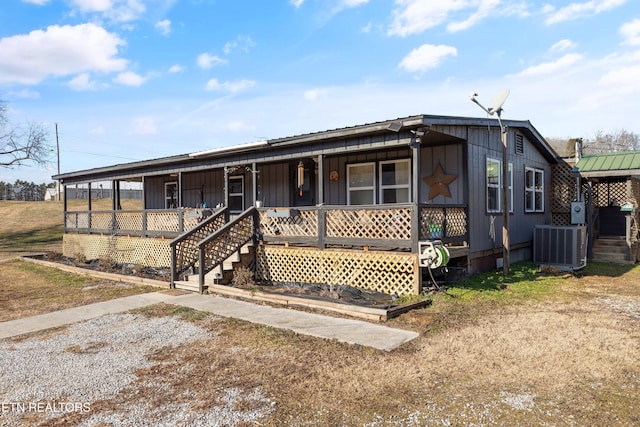 view of front of property featuring covered porch and central air condition unit