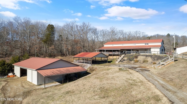 back of property with an outdoor structure