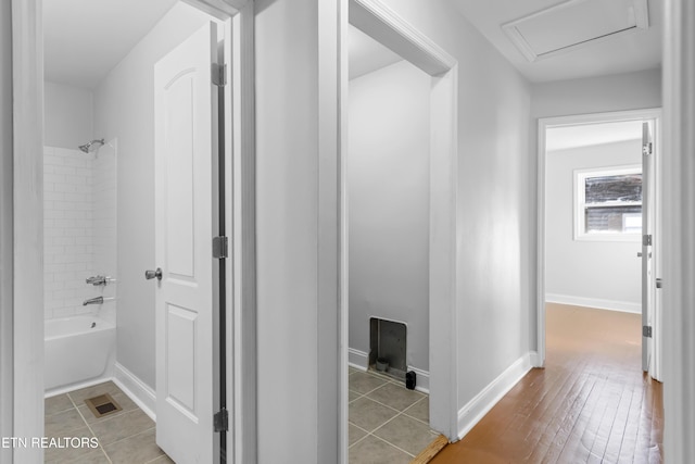 hall with light tile patterned flooring