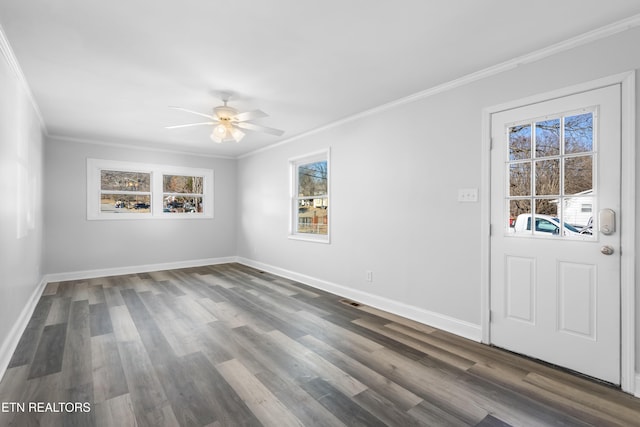 unfurnished room with ceiling fan, ornamental molding, and dark hardwood / wood-style floors