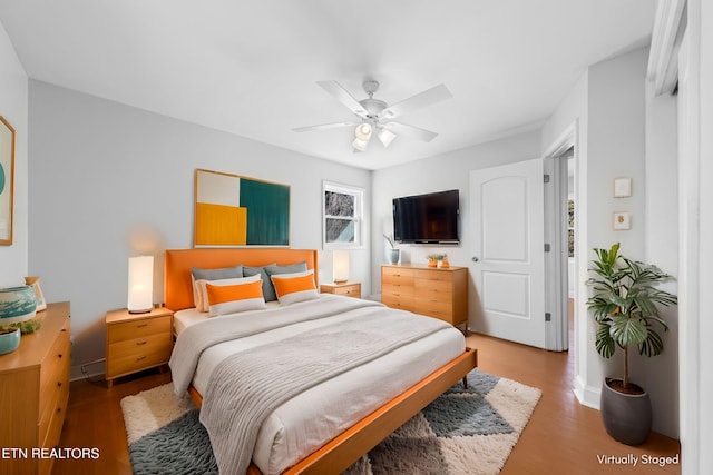 bedroom featuring wood-type flooring and ceiling fan