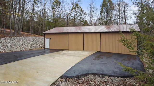 view of patio / terrace with an outbuilding