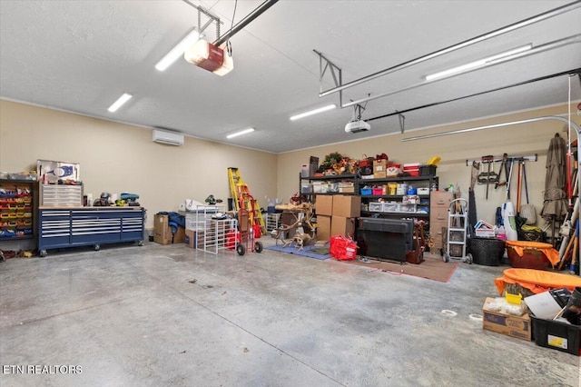 garage with a wall mounted air conditioner, a garage door opener, and a workshop area