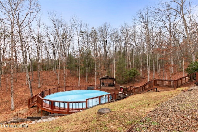 view of swimming pool with a gazebo