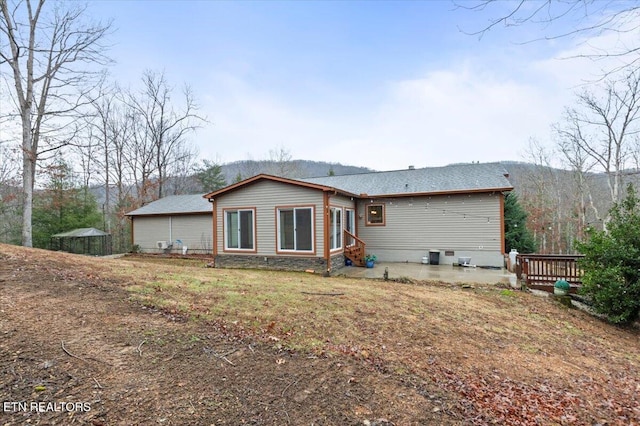 back of property with a patio area