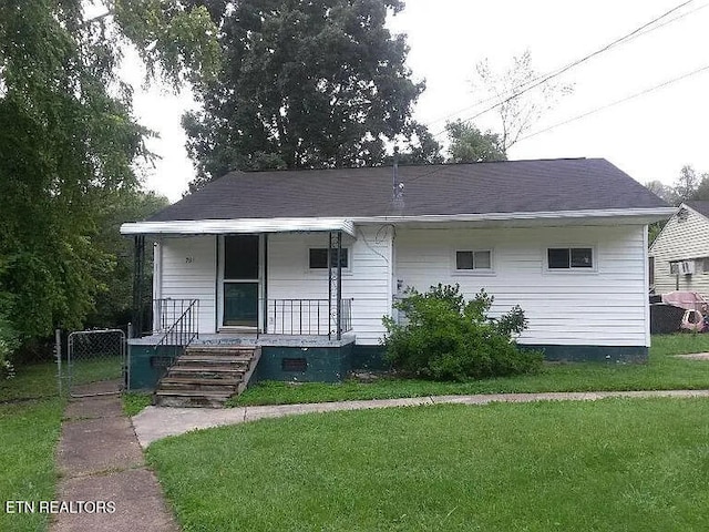 view of front of house with a front yard and a porch