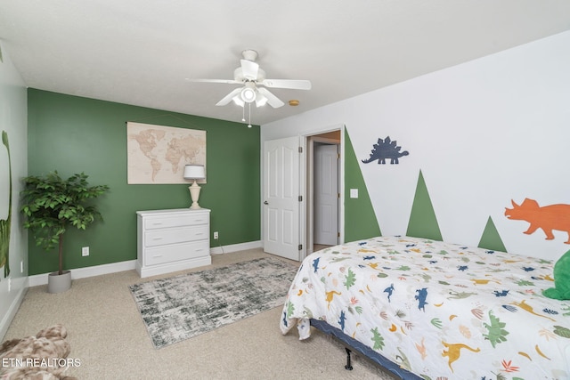 bedroom with baseboards, carpet, and a ceiling fan