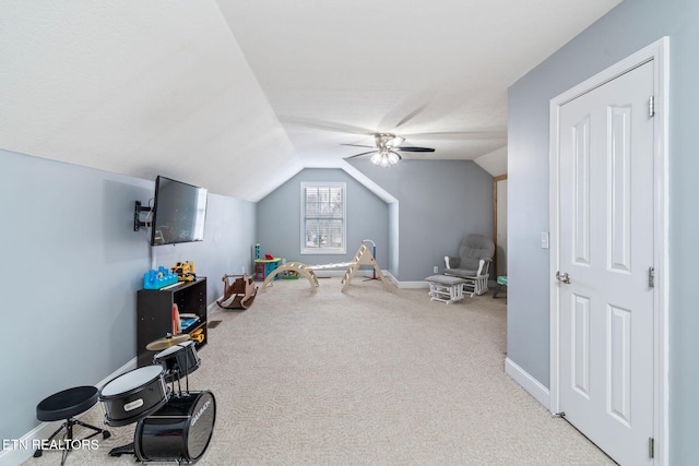 game room featuring baseboards, lofted ceiling, ceiling fan, and carpet flooring