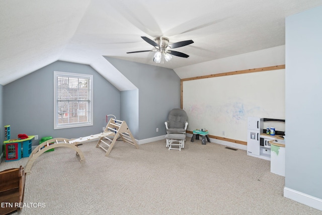 game room with visible vents, baseboards, carpet, lofted ceiling, and a ceiling fan