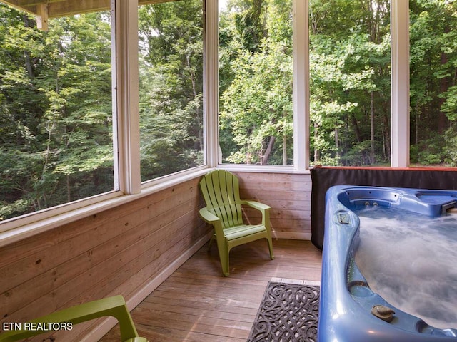 unfurnished sunroom with a jacuzzi