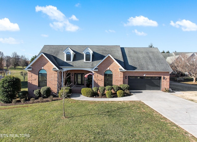 view of front property with a garage and a front yard