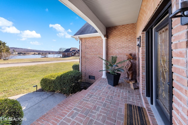 view of patio / terrace featuring a water view