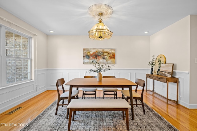 dining area with hardwood / wood-style flooring