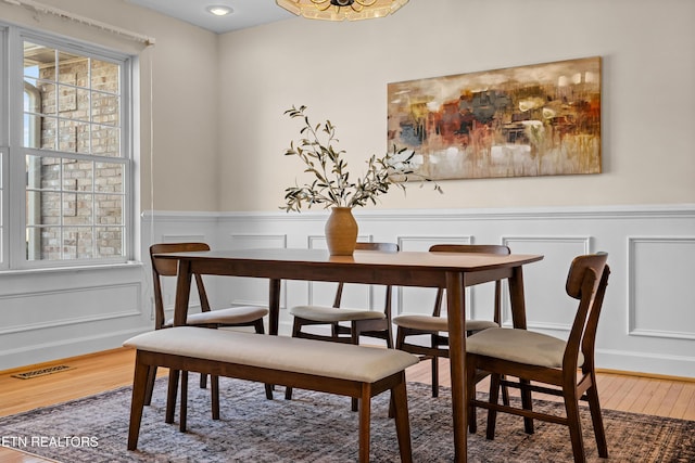 dining space featuring wood-type flooring