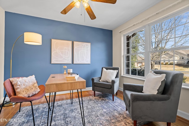 home office featuring ceiling fan and hardwood / wood-style floors