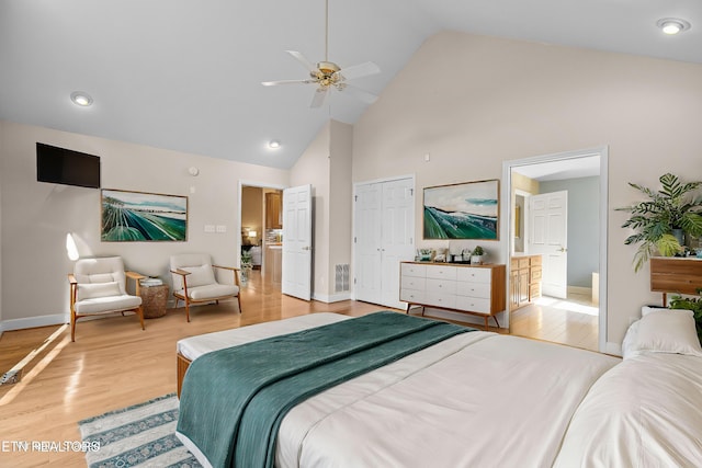 bedroom with ceiling fan, high vaulted ceiling, light hardwood / wood-style floors, and a closet