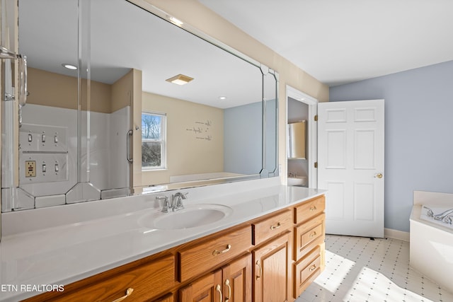 bathroom featuring vanity and a tub