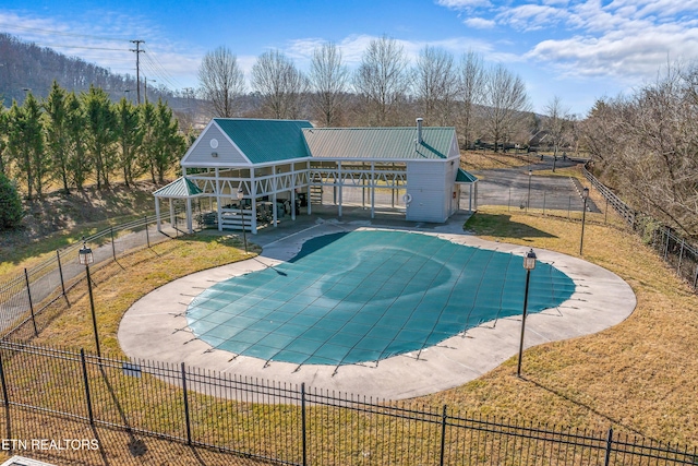 view of pool with a yard and a patio area