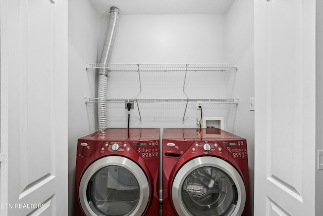 washroom featuring washer and clothes dryer