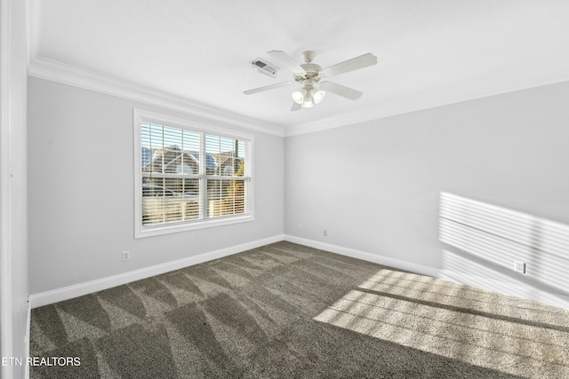 spare room featuring crown molding, ceiling fan, and dark carpet