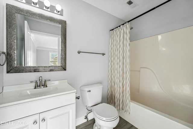 full bathroom with shower / bath combination with curtain, vanity, and toilet