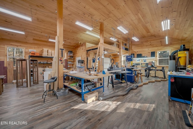 miscellaneous room featuring wood finished floors, a workshop area, wooden walls, and wood ceiling