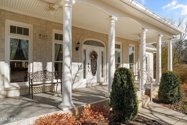 property entrance featuring ceiling fan and a porch