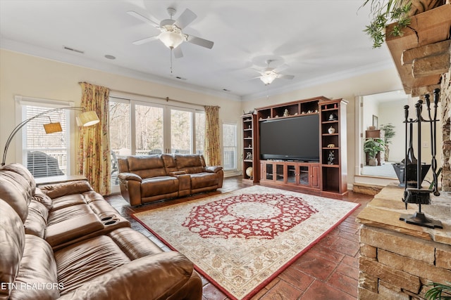 living room featuring crown molding and ceiling fan