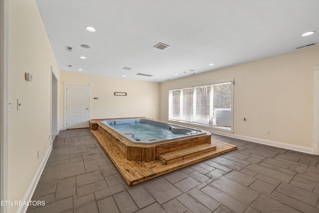 recreation room featuring a hot tub