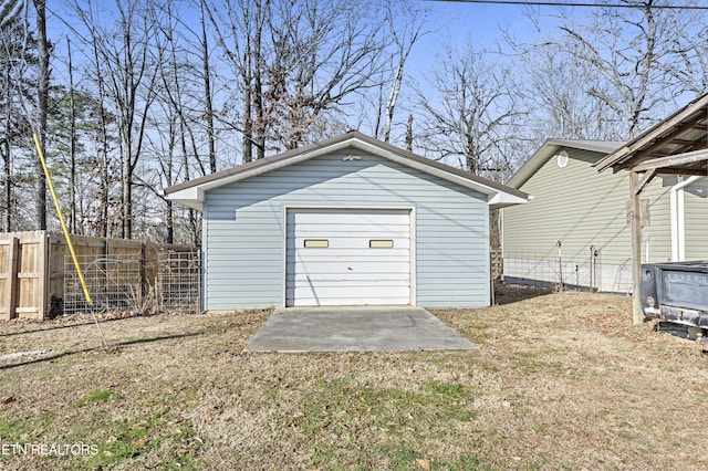 garage featuring a lawn