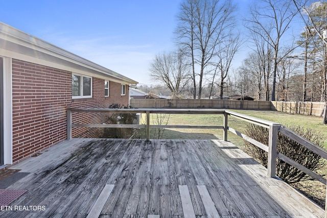 wooden deck with a yard