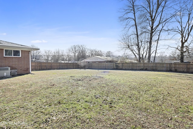 view of yard with central AC unit