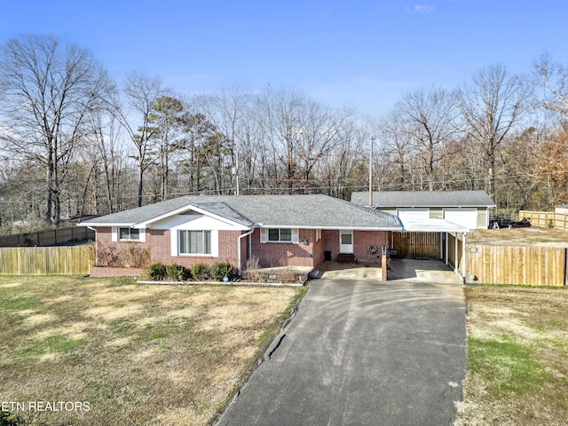 ranch-style home with a front lawn