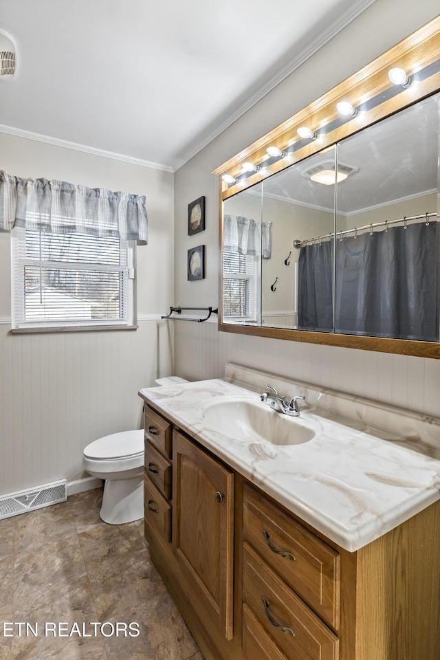 bathroom featuring vanity, curtained shower, and toilet