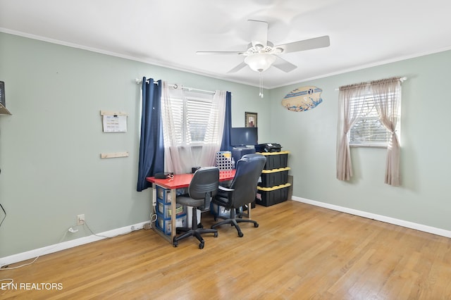 office area featuring crown molding, wood-type flooring, and ceiling fan